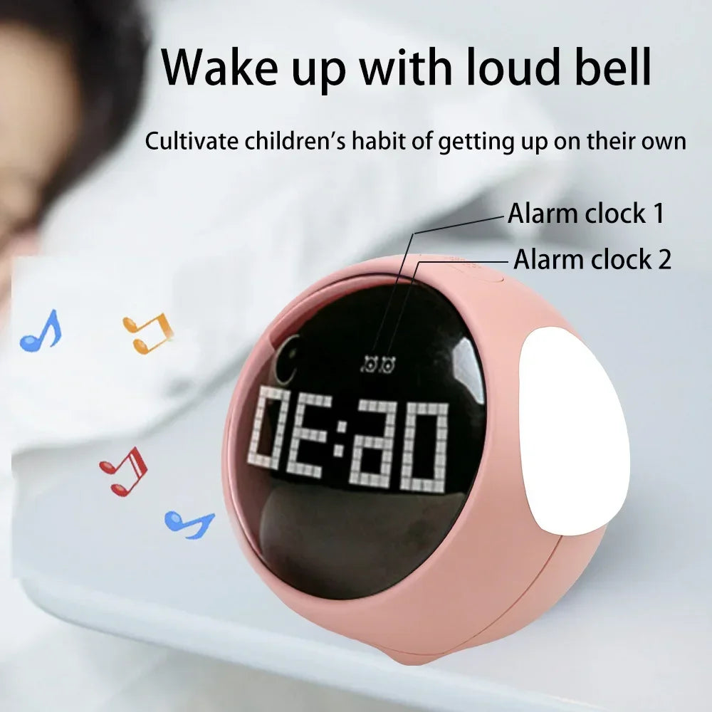 Pink kawaii alarm clock with digital display and text indicating dual alarms and loud bell feature.