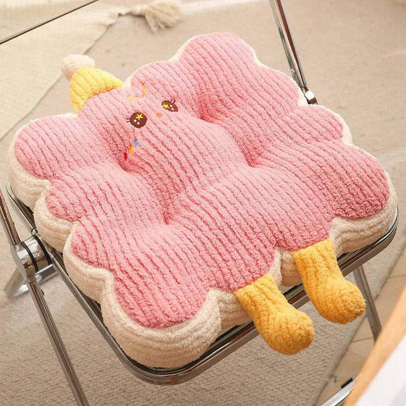 Pink cloud-shaped kawaii cushion with yellow legs on a chair