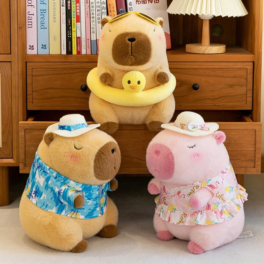 Three kawaii plush toys, two bears and one pig, wearing summer outfits in front of a wooden bookshelf.
