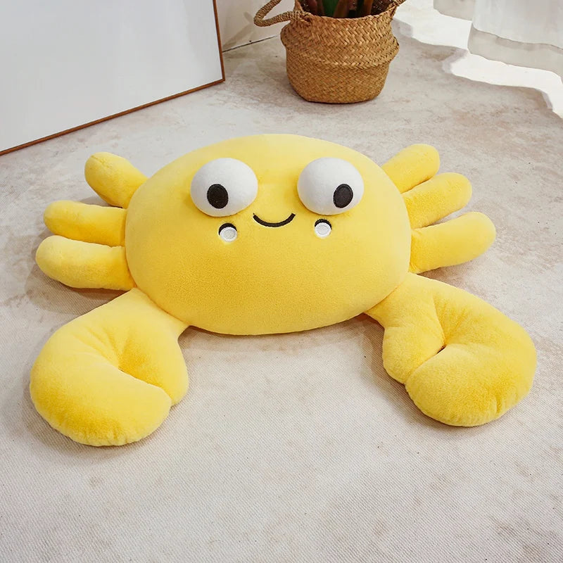 Yellow kawaii plush crab toy on a light-colored floor.