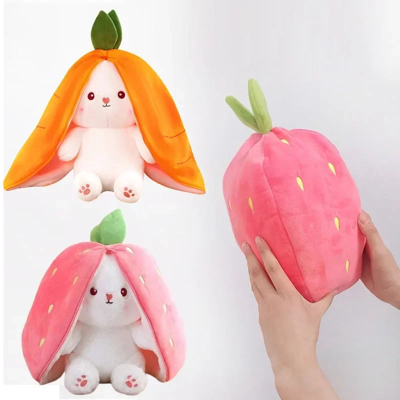 Plush kawaii toys shaped like a carrot and a strawberry with a hand holding one of them.