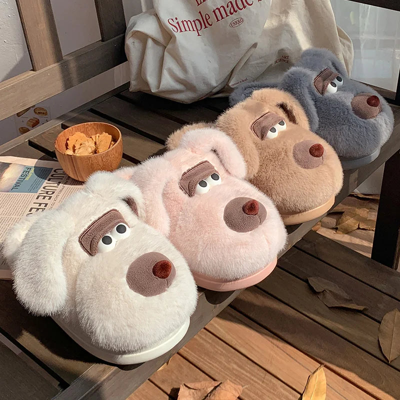 Four plush dog kawaii slippers in different colors on a wooden surface.