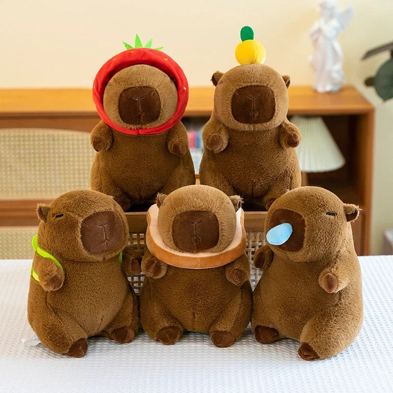 Five brown kawaii plush toys with colorful hats on a white surface.