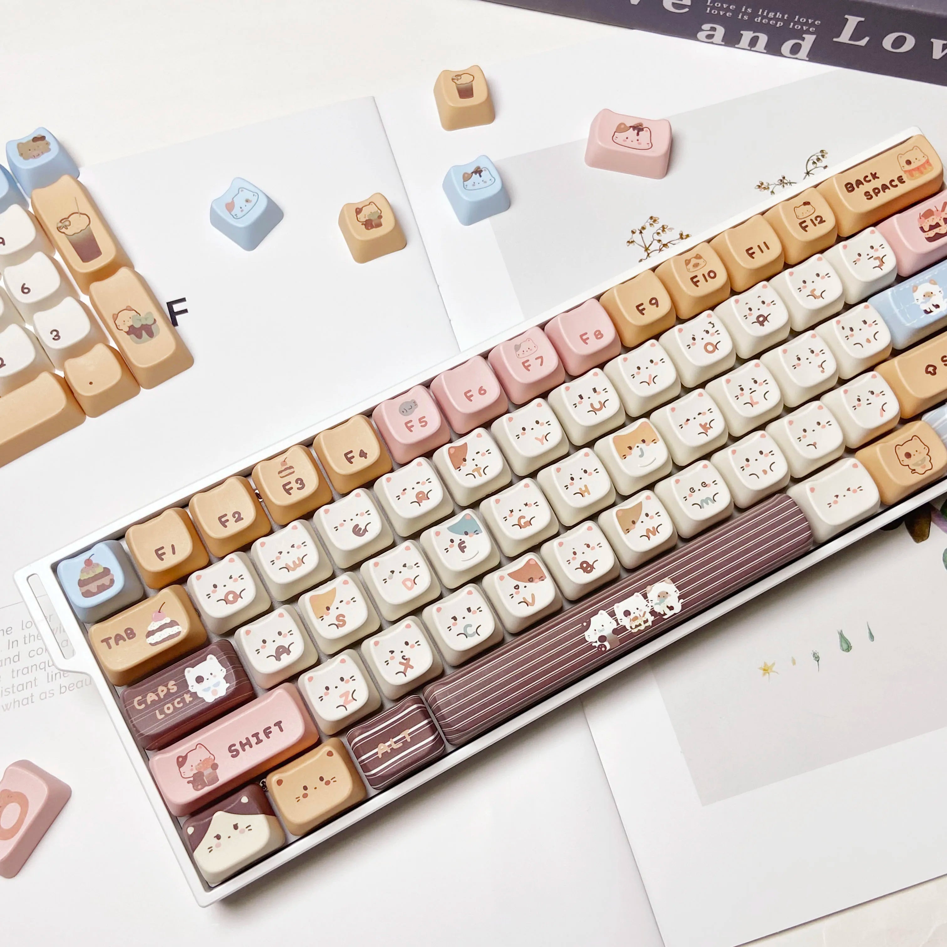 Keyboard with Kawaii keycaps on a white surface