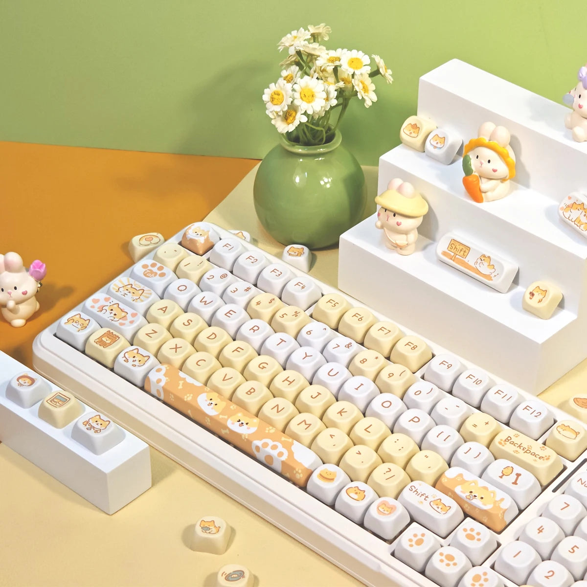 Keyboard with Kawaii keycaps on a desk with decorative items