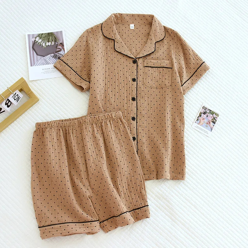 Brown polka dot kawaii pajama set on a white surface with small photos in the background.