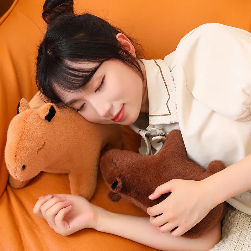 Child sleeping with kawaii stuffed animals on an orange couch