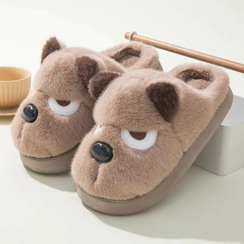 Pair of kawaii brown bear-shaped slippers on a light background