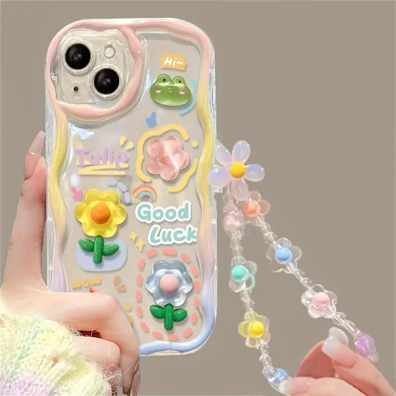Phone case with kawaii floral designs and a lanyard held by a hand