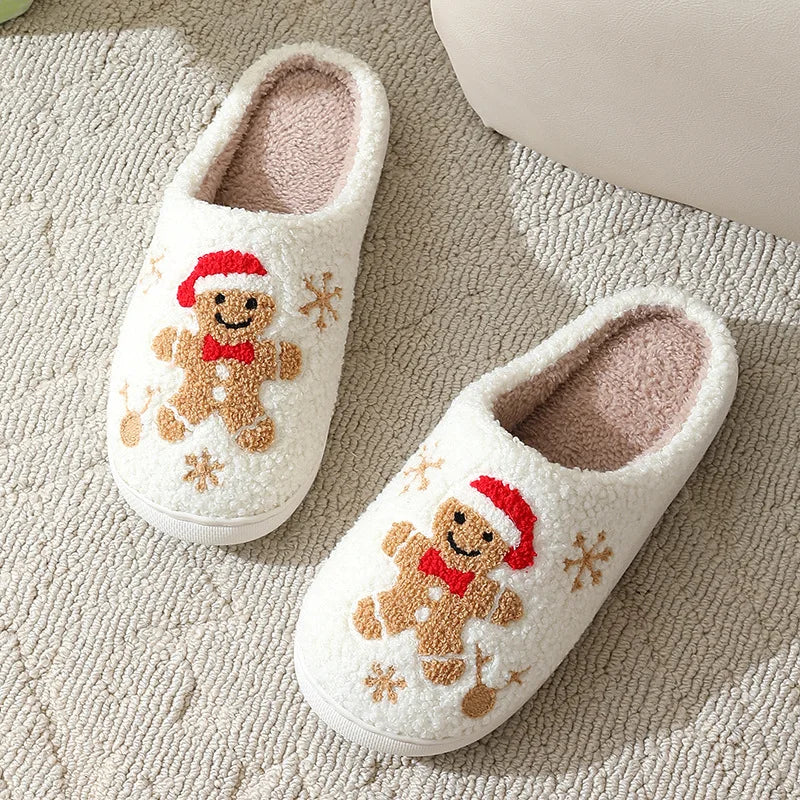 Pair of white kawaii slippers with gingerbread man design on a textured surface