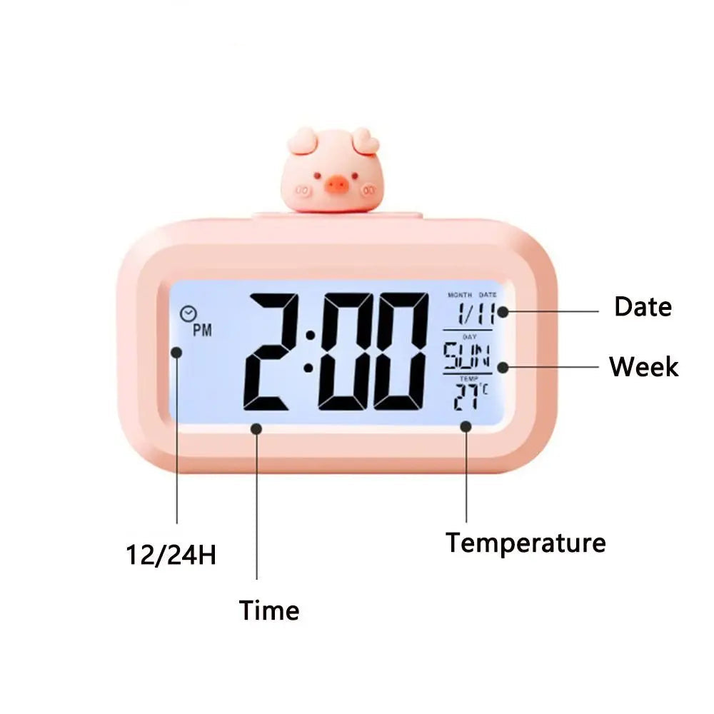 Kawaii digital clock with piggy design on top, showing time, date, temperature, and 12/24H format.