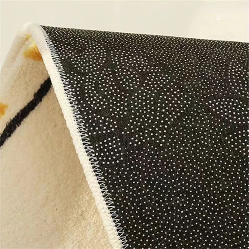 Close-up of a textured black and beige kawaii-style fabric edge