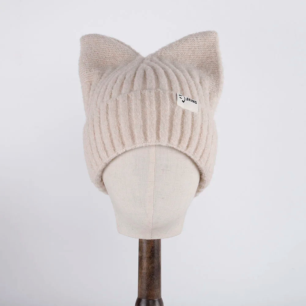 Beige cat ear Kawaii beanie on a mannequin head against a white background