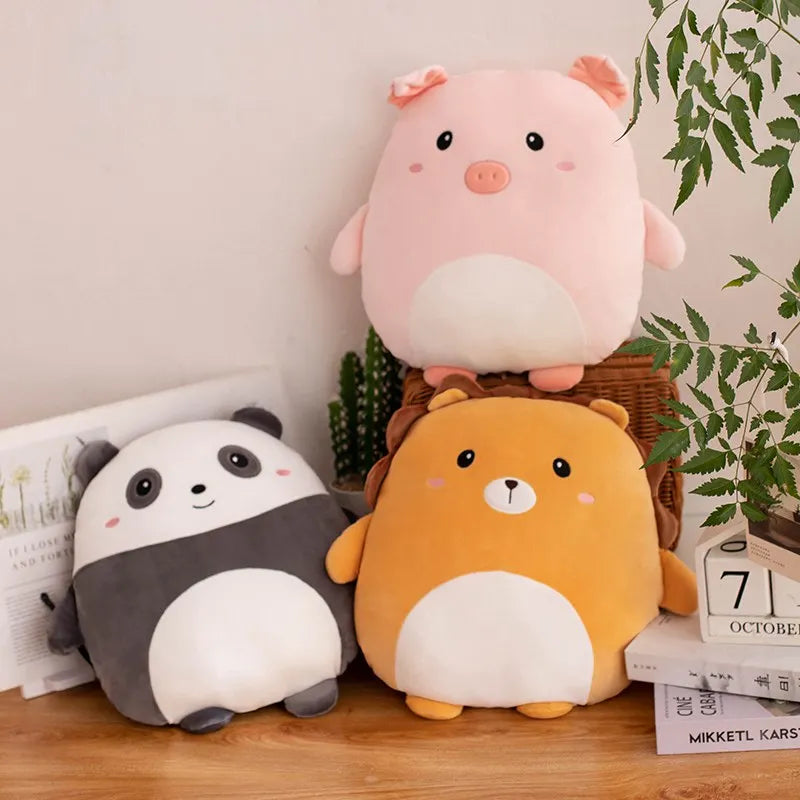 Three cute animal kawaii plush toys (pig, panda, and bear) on a wooden surface with a plant in the background.