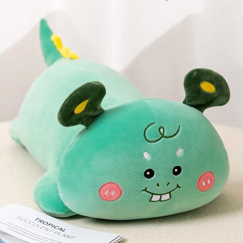 Green kawaii plush toy with a face on a white background