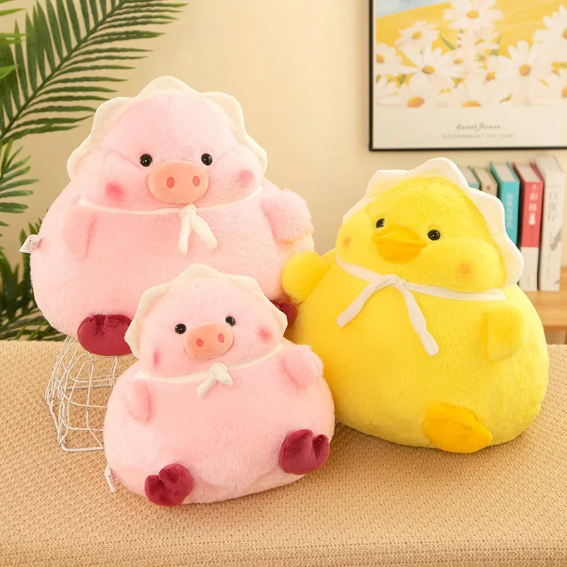 Two pink pig kawaii plush toys and a yellow duck plush toy on a beige surface with a blurred background.
