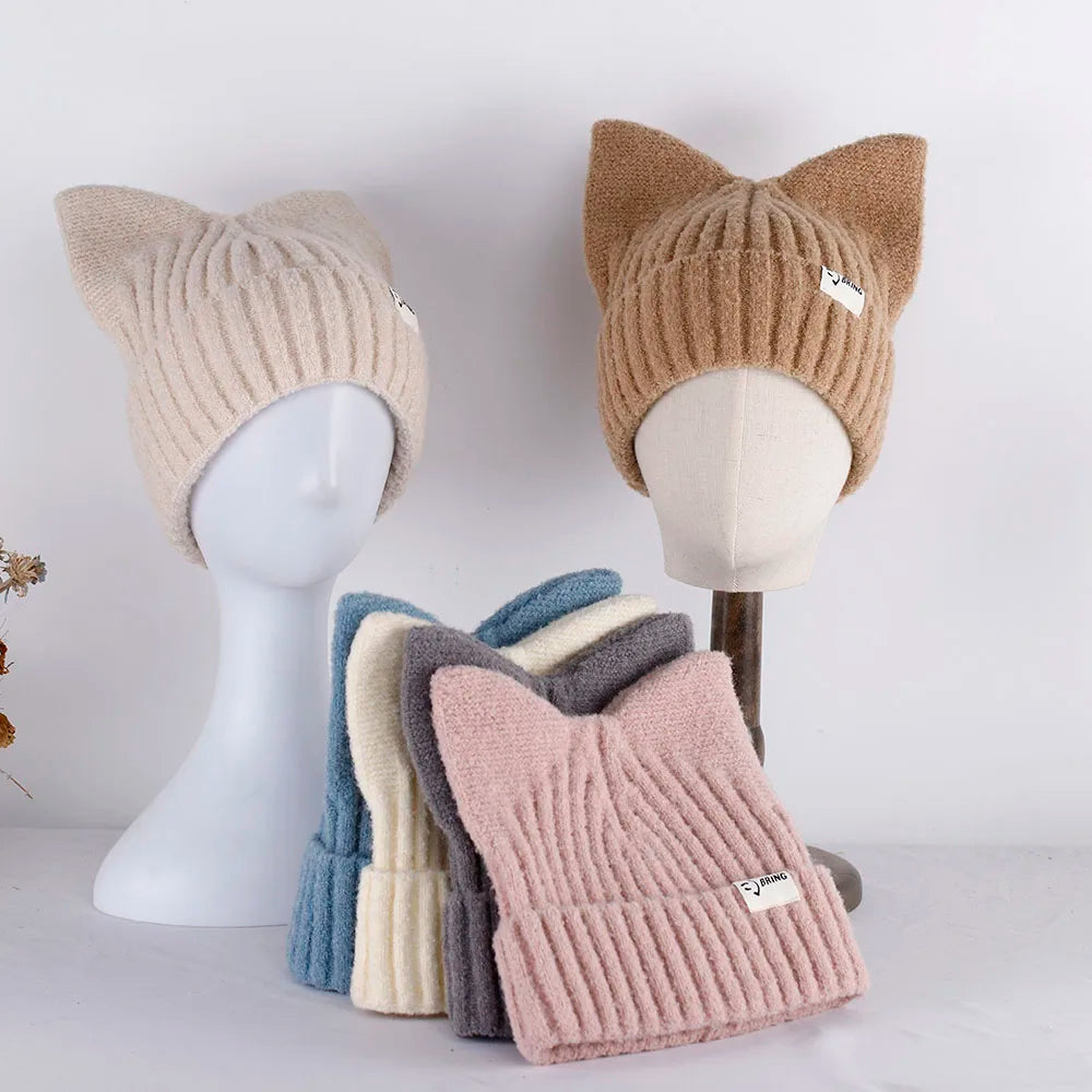 Cat ear Kawaii hats in various colors on mannequin heads with a white background