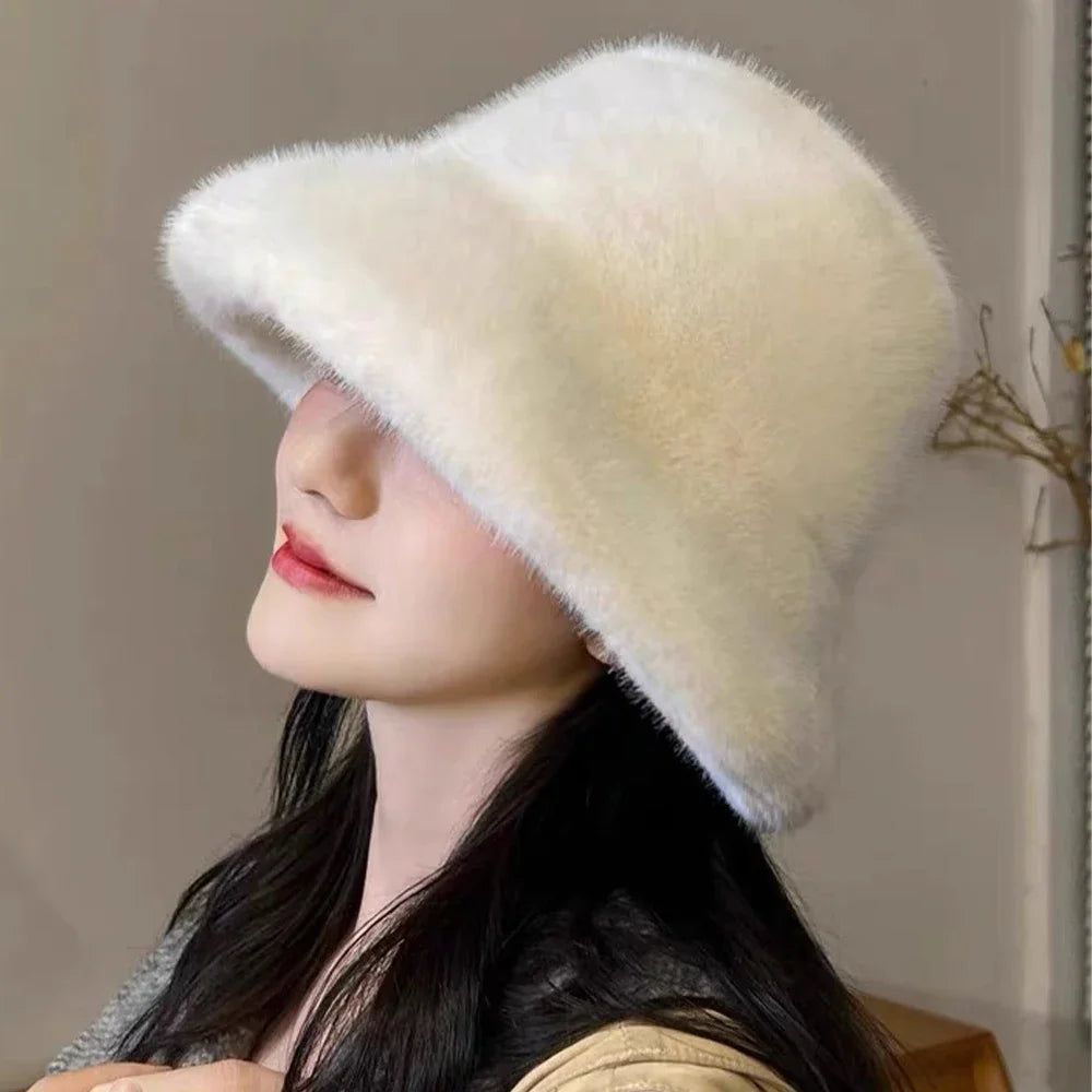 Woman wearing a fluffy Kawaii white hat against a neutral background