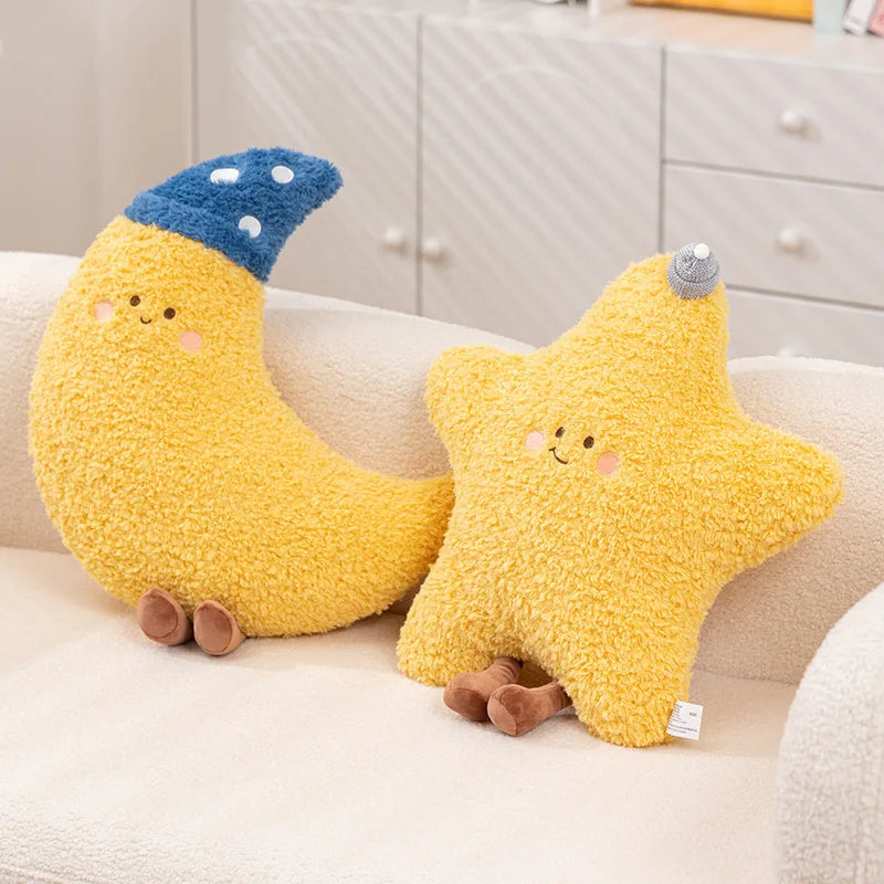 Two kawaii plush toys shaped like a banana and a star on a couch.
