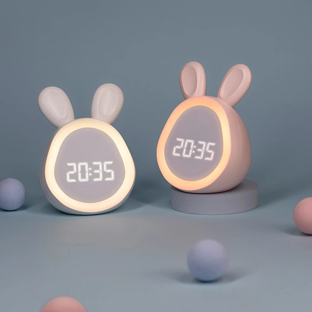 Two rabbit-shaped kawaii digital clocks on a gray background