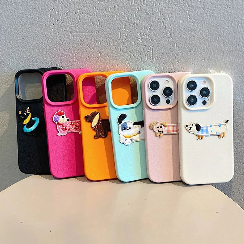 Set of colorful kawaii phone cases with cartoon dog designs on a gray background