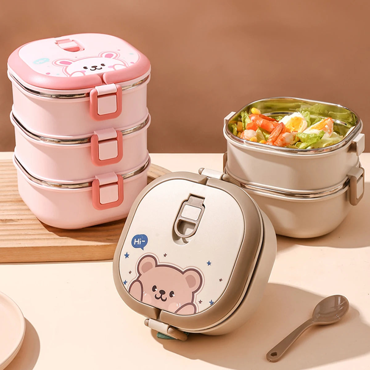 Stackable lunch containers with kawaii bear design on a beige background