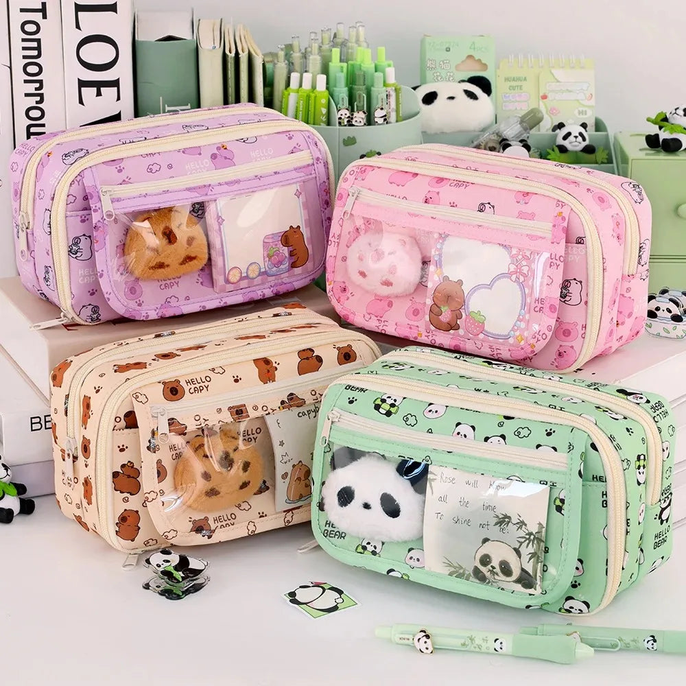 Four cute kawaii pencil cases with animal designs on a white surface.