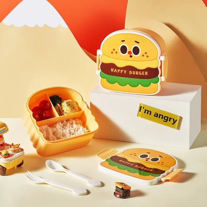 Yellow kawaii cartoon hamburger-shaped lunch box with a small sign saying 'I'm angry' on a colorful background.