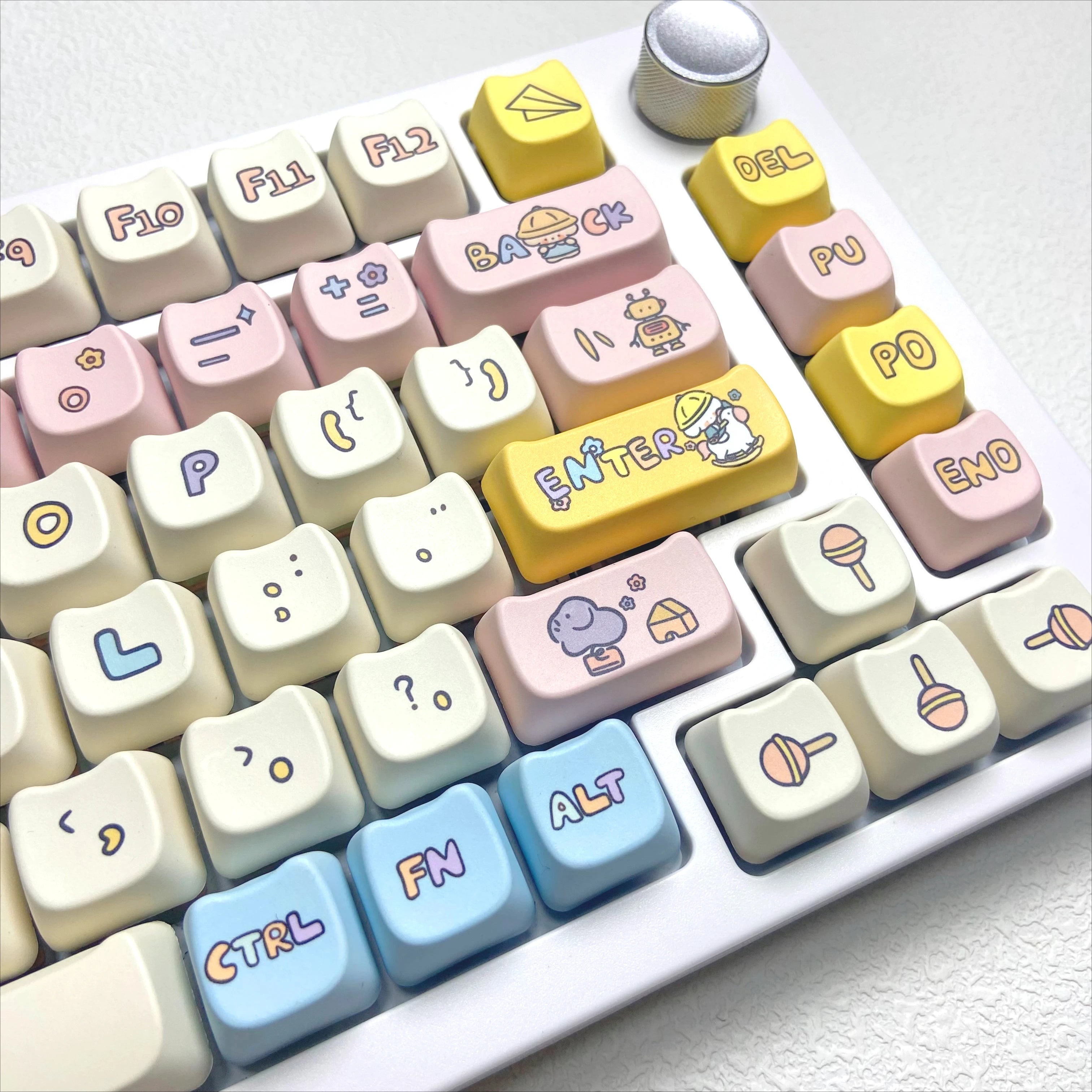 Colorful keyboard with Kawaii cartoon character keycaps on a white background