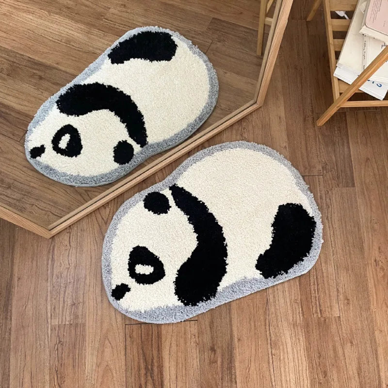 Two panda-shaped kawaii rug on a wooden floor.