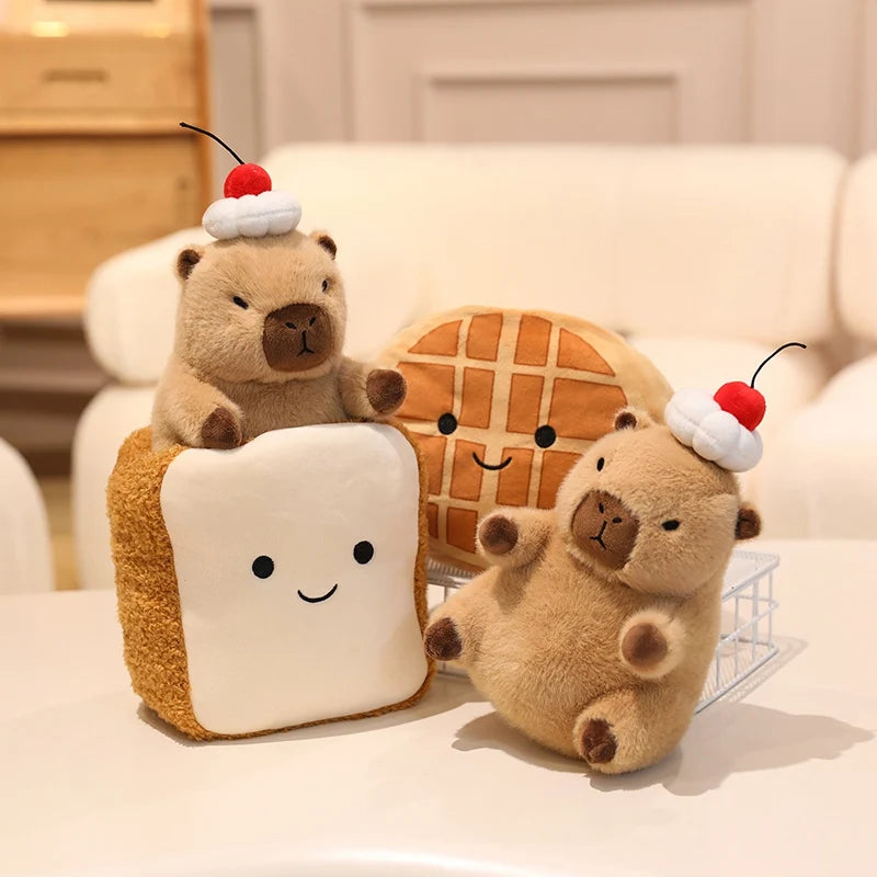 Two kawaii plush toys resembling a bear and a waffle on a white surface with a neutral background.