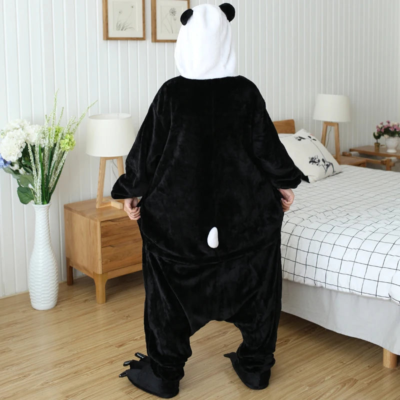 Person wearing a kawaii panda onesie in a bedroom setting