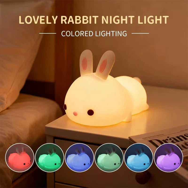 Lovely rabbit kawaii night light with colored lighting options on a bedside table.