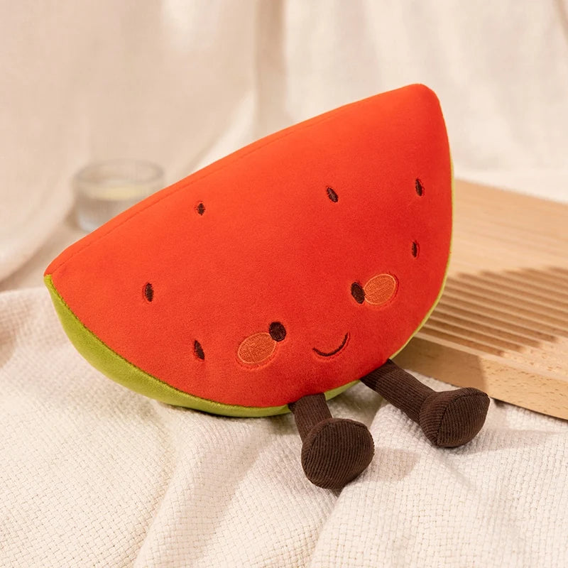 Plush kawaii toy shaped like a watermelon slice with legs and a face on a white fabric background.