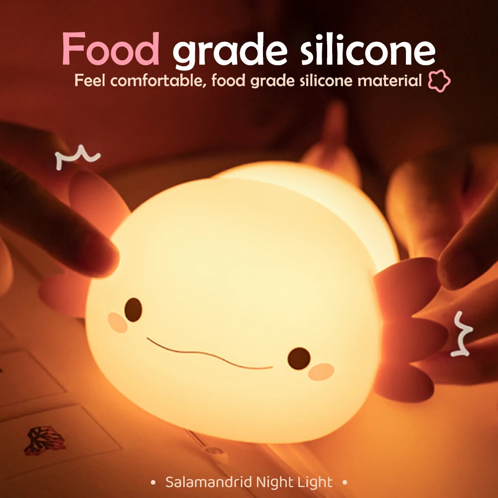 Cute kawaii Axolotl night light held by hands with text about food grade silicone material.