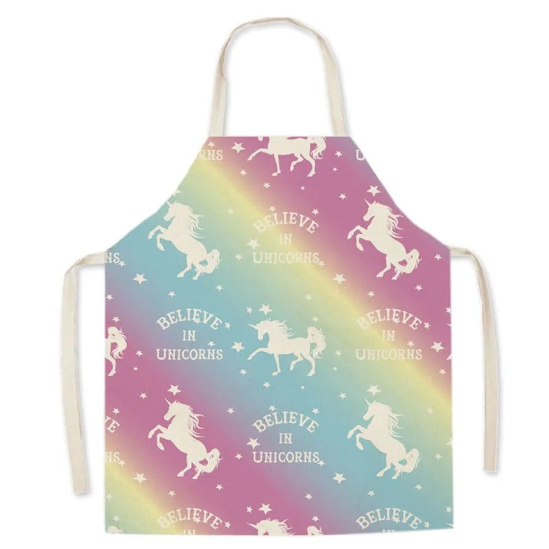 Unicorn-themed Kawaii apron with rainbow gradient and 'Believe in Unicorns' text on a white background
