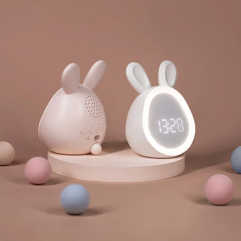 Two rabbit-shaped kawaii night lights on a brown background