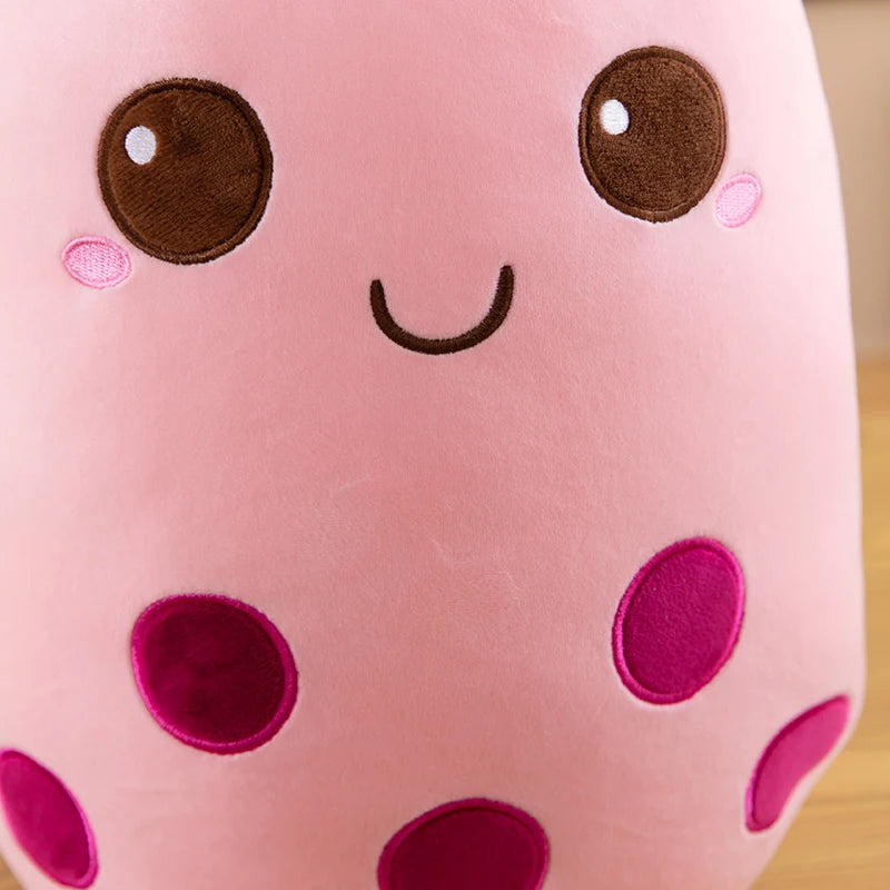 Close up of a kawaii plushie in the shape of boba tea