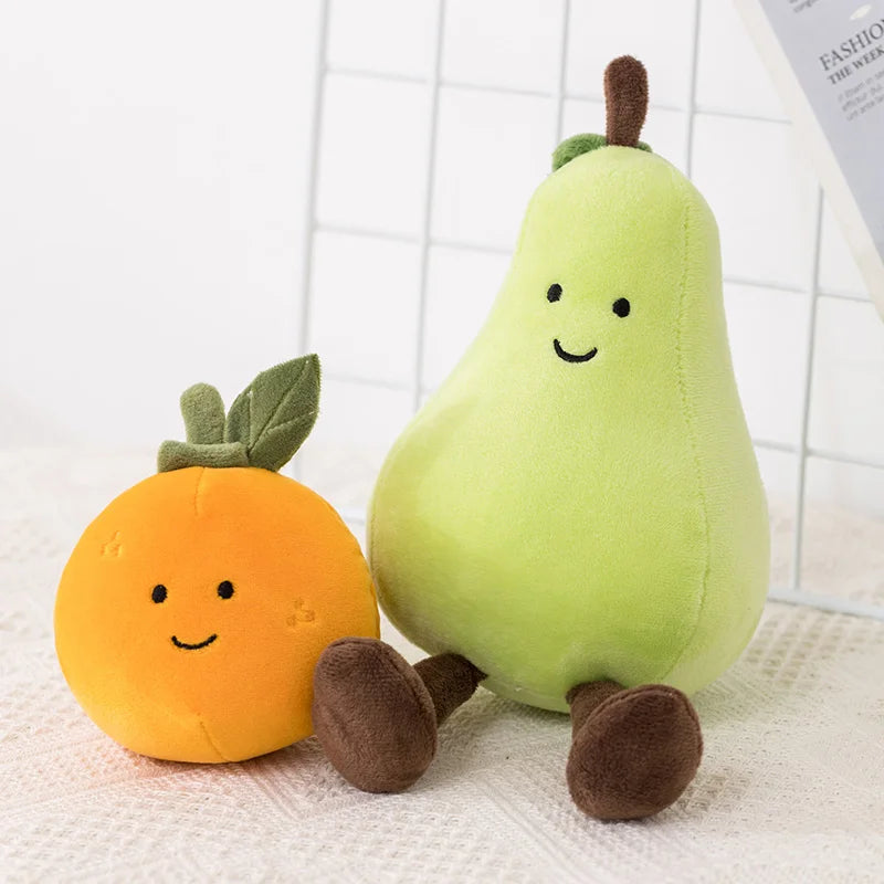 Plush kawaii toys shaped like an orange and a pear on a textured surface with a white grid background.