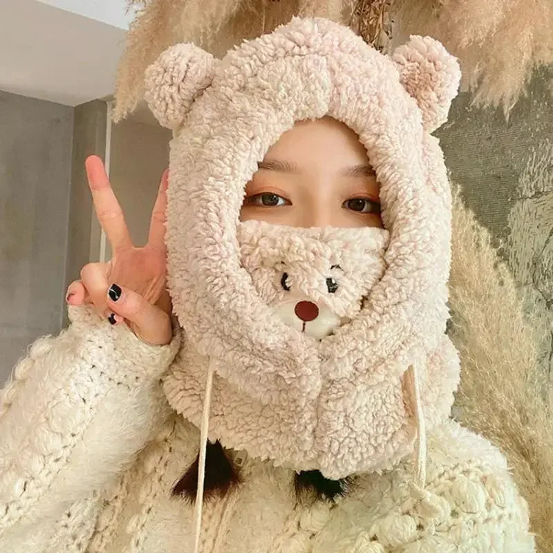 Person wearing a fluffy Kawaii bear-themed hood with a bear face design, giving a peace sign.