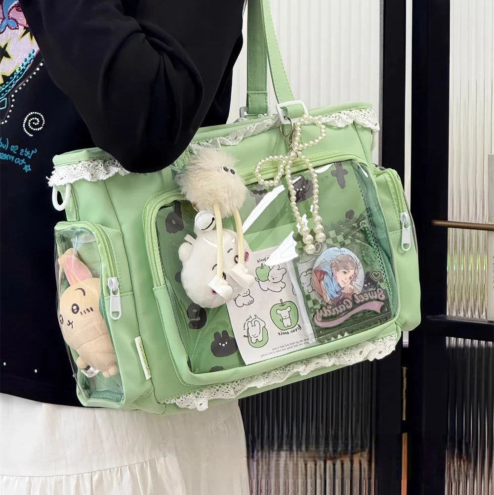 Green transparent Kawaii handbag with decorative elements held by a person