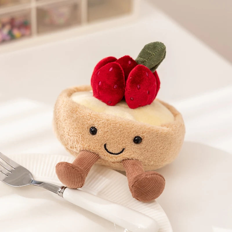 Plush kawaii toy resembling a dessert with berries on a white surface