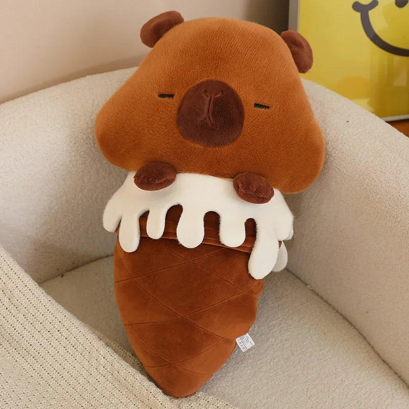 Kawaii plush toy shaped like a brown ice cream cone with a face on a beige couch.