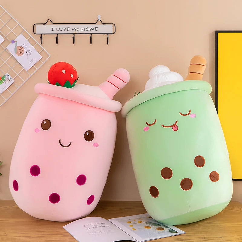 Two kawaii plushies in the shape of boba tea