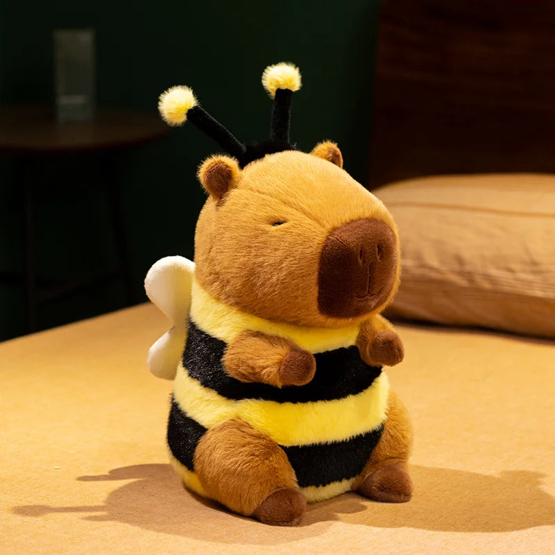 Kawaii plush toy bee sitting on a surface with a blurred background