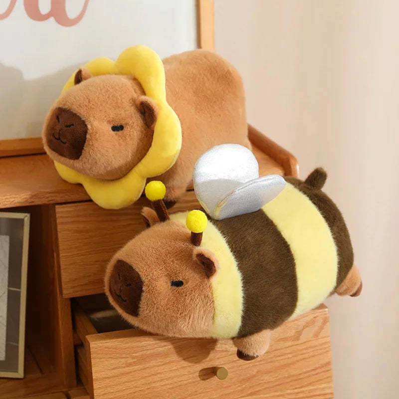 Two kawaii plush toys resembling a bear and a bee on a wooden surface.