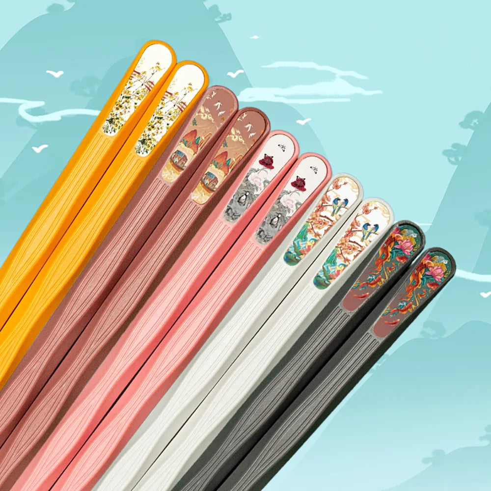 Set of kawaii colorful chopsticks with decorative ends on a light blue background