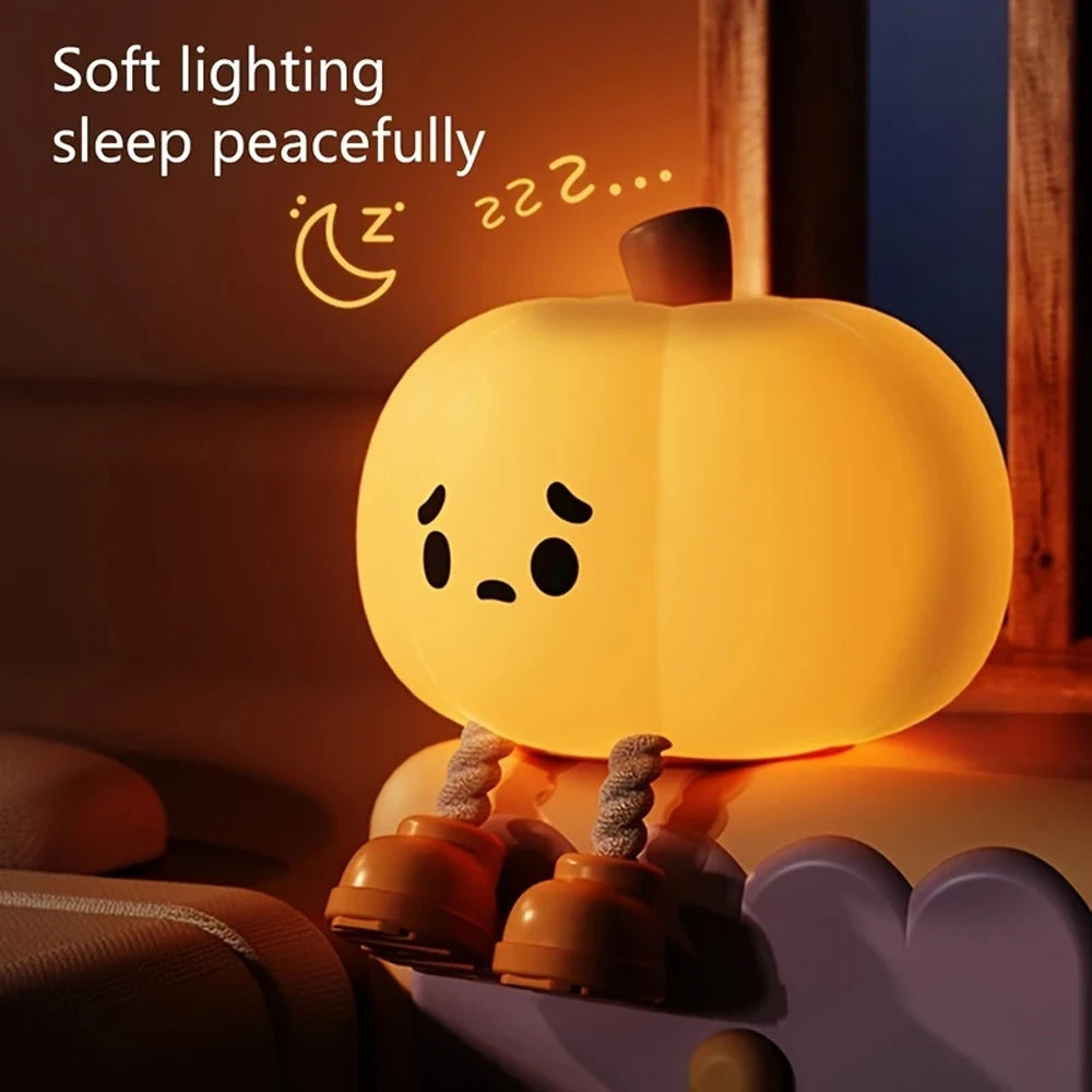 Cute kawaii pumpkin-shaped night light with a soft glow on a dark background