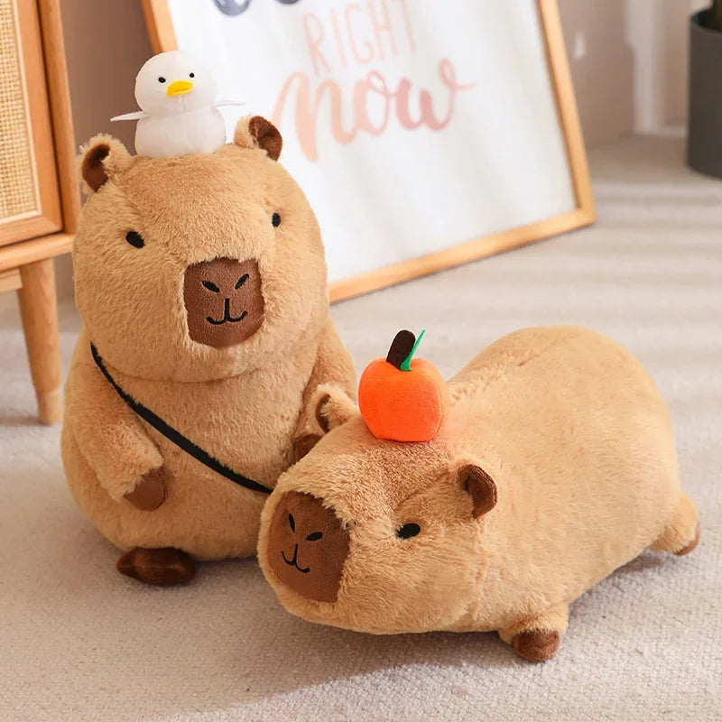 Two plush kawaii toys resembling guinea pigs on a carpeted floor with a decorative sign in the background.