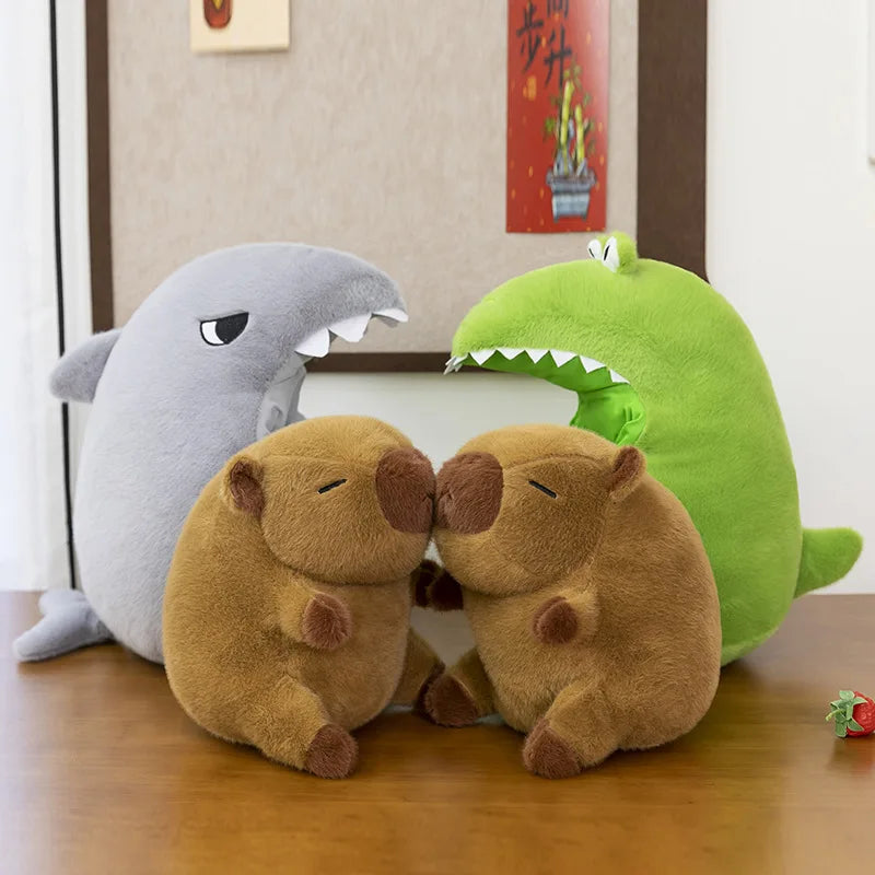 Four kawaii plush toys including a shark, two bears, and a green creature on a wooden floor.